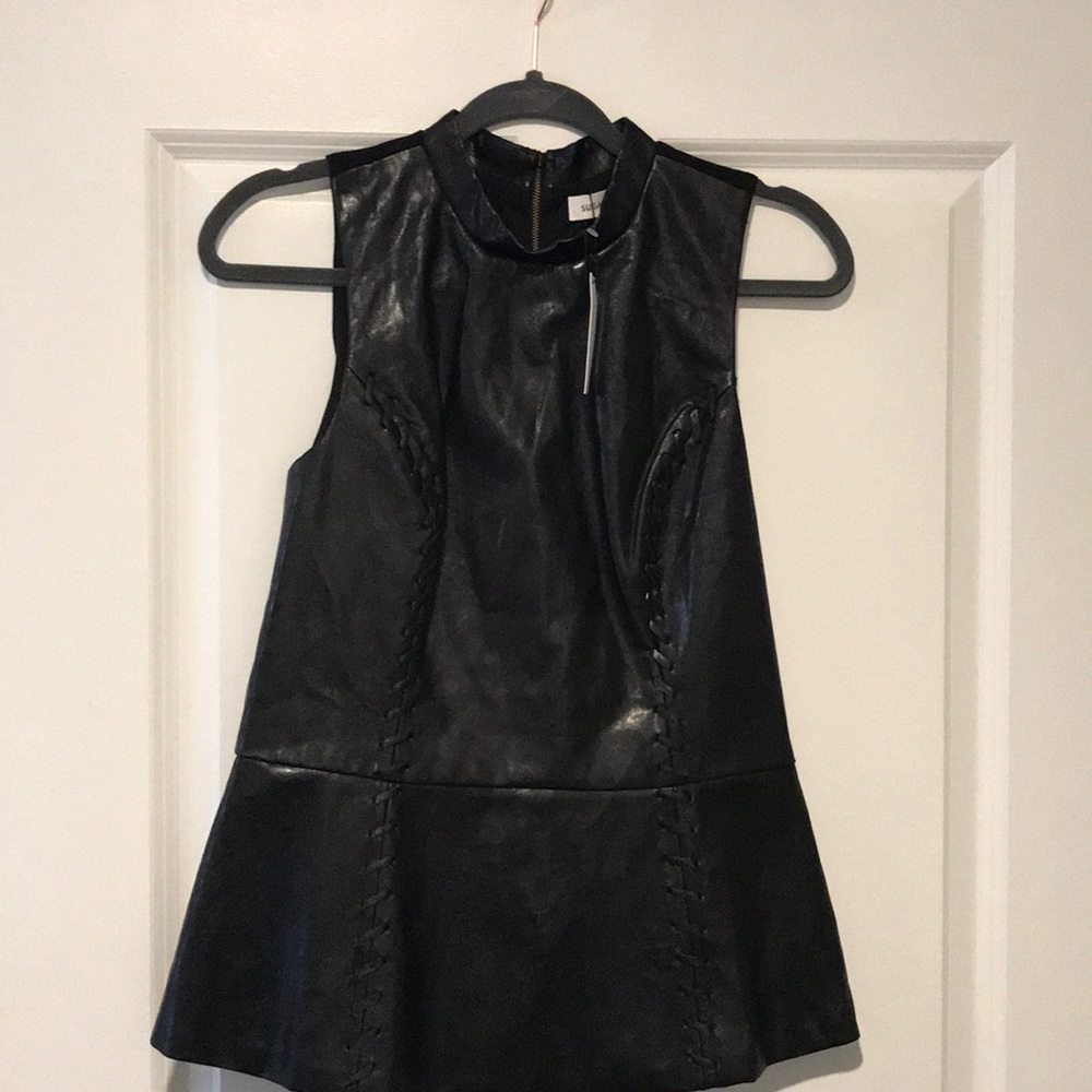 Faux leather peplum top with zipper up the back